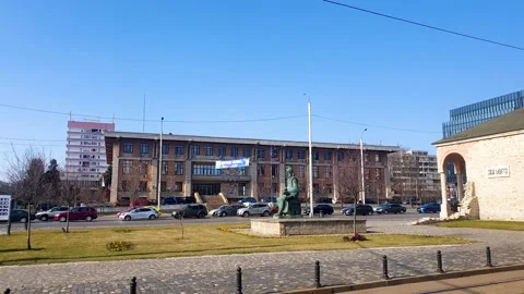 View of intersection with traffic and activity of people during a sunny day Stock Footage 204966536