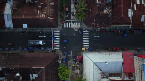 View of Iquitos, Peru from above, showcasing mototaxis and cars navigating Stock Footage 324248087