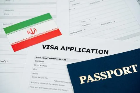 View of Iran visa application form with passport and national flag Stockfoto's