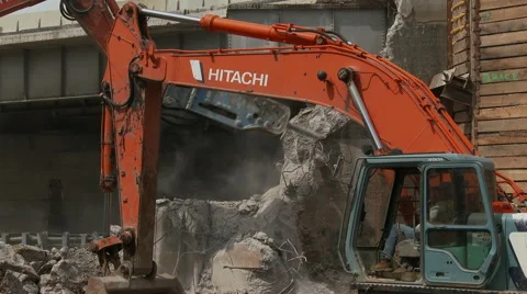 View of jack-hammer through arm of back hoe Stock Footage 49893672