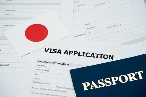 View of Japan visa application form with passport and national flag Stockfoto's