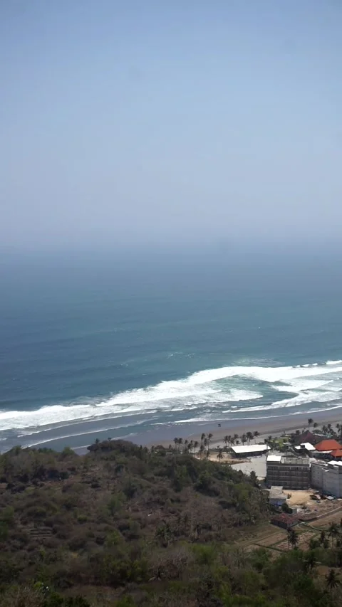 View of Java&amp;#039;s southern coast and the crashing waves of Parangtritis Beach Stock Footage 346885857