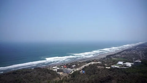 View of Java&amp;#039;s southern coast and the crashing waves of Parangtritis Beach Stock Footage 346885911