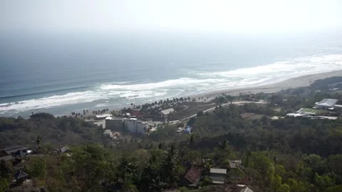 View of Java&amp;#039;s southern coast and the crashing waves of Parangtritis Beach Stock Footage 346886210