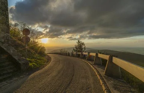 View from Jested hill on spring landscape with color sunset and asphalt road Stock Photos