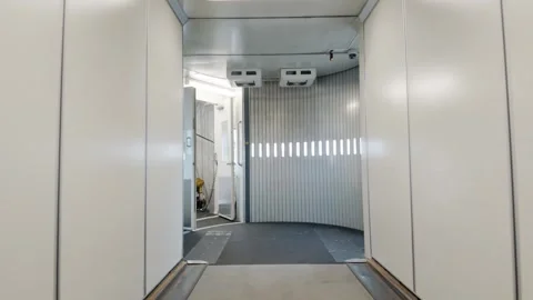 View from Jet Bridge Pulling Back from Open Airplane Door Stock Footage 345935850