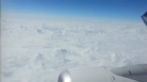 View of a jet engine outside the window of an airplane flying through the atmosp Stock Footage 40257743