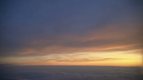 View from the jet plane window on beautiful sunset in sky with reflects on wing. Stock Footage 104017152