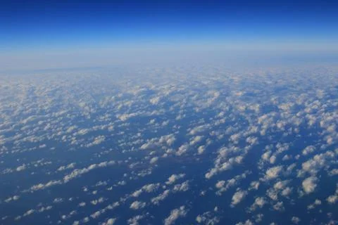 View of jet plane wing with cloud patterns Fotos Stock
