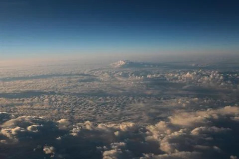 View of jet plane wing with cloud patterns Fotos Stock