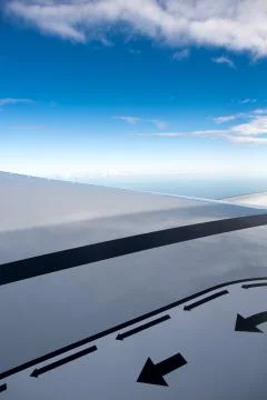 View of jet plane wing with safety markers Stock Photos