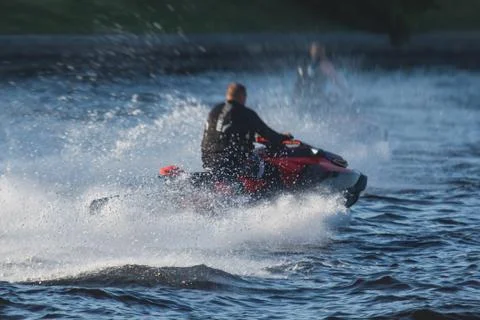View of jet ski in motion, group of jet skiers with a big water splash Фото