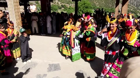 View of Kalash people dancing in traditional attire, Pakistan. Video stock 343877053