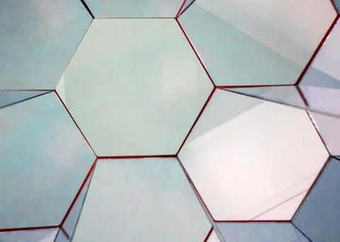 View of a kaleidoscope of mirrors in the form of regular hexagons of silver Stock Photos