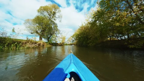 View from kayak. Inside canoe. Footage of amazing nature on lake. Kayaking on Stock Footage 238740005