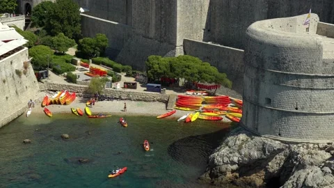 View of kayakers at Pile Bay returning from a tour outside the walls at Stock Footage 142139811