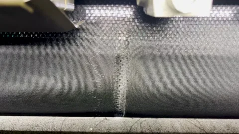 A view of knitting defects on the fabric of a thread break Stock Footage 274125474