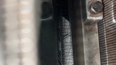 A view into a knitting machine where one of the threads is broken Stock Footage 314348744