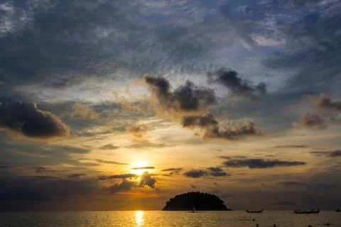 View of Koh Pu island at sunset from Kata Phuket beach, Thailand Stock Photos