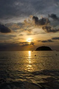 View of Koh Pu island at sunset from Kata Phuket beach, Thailand Stock Photos
