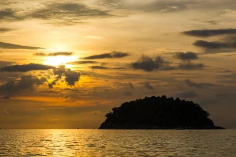View of Koh Pu island at sunset from Kata Phuket beach, Thailand Stock Photos