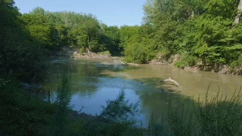 View of Kuma river with orange and brown water in Ossetian mountains Stock Footage 93798061