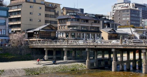 View of Kyoto bridge during cherry blossom season Stock Footage 106649509