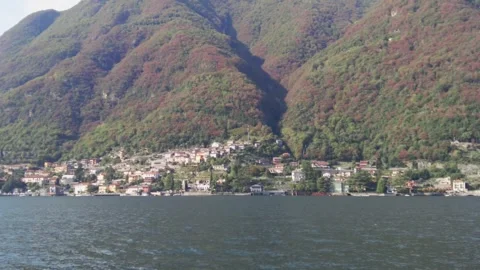 View of Laglio on Lake Como shore from ferryboat. A small lovely town with be Stock Footage 255885839