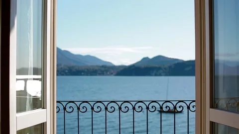 View of Lago Maggiore through closing window. Stock Footage 84061194