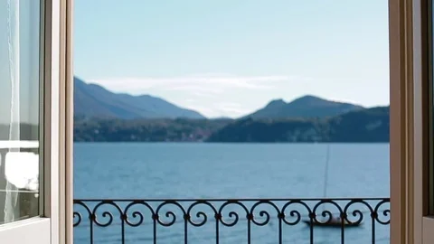 View of Lago Maggiore through closing window. Stock Footage 84686572
