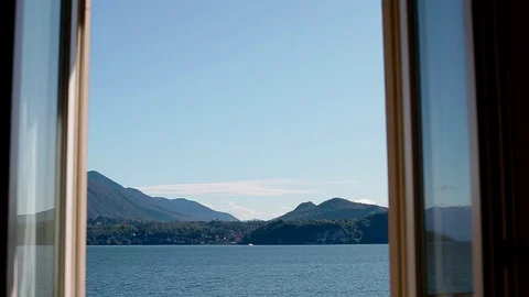 View of Lago Maggiore through closing window. Stock Footage 86467209