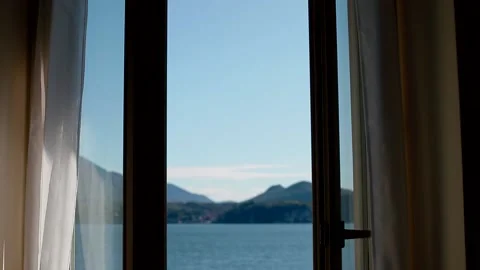 View of Lago Maggiore through closing window Stock Footage 150861236
