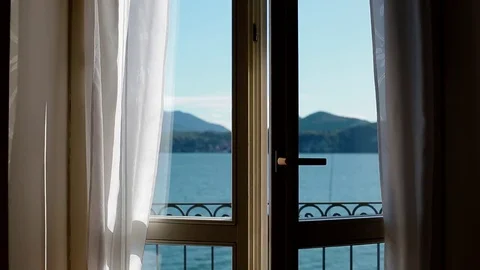 View of Lago Maggiore through opening window Stock Footage 84061108