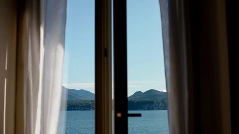 View of Lago Maggiore through opening window Stock Footage 86467148