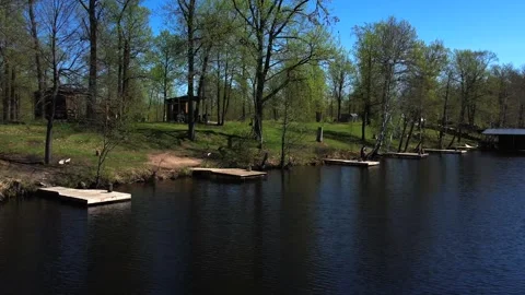View of the lake from above. Early spring. Fishing lake with fishing platforms Stock Footage 274413769