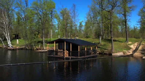 View of the lake from above. Early spring. Fishing lake with fishing platforms Stock Footage 274413770