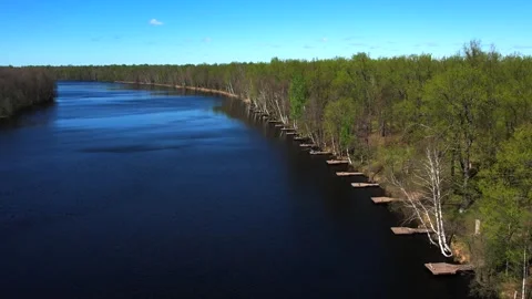 View of the lake from above. Early spring. Fishing lake with fishing platforms Stock Footage 274413779