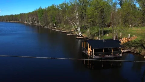 View of the lake from above. Early spring. Fishing lake with fishing platforms Stock Footage 274413792