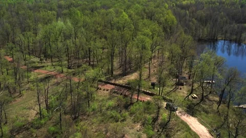 View of the lake from above. Early spring. Fishing lake with fishing platforms Stock Footage 274413808