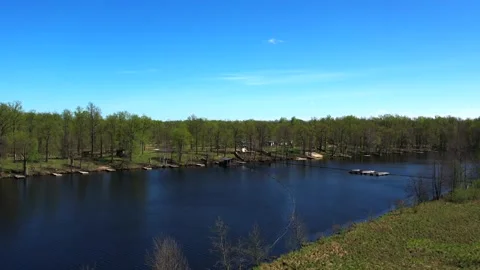 View of the lake from above. Early spring. Fishing lake with fishing platforms Stock Footage 274413816