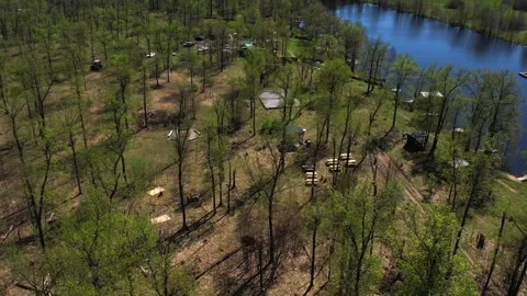 View of the lake from above. Early spring. Fishing lake with fishing platforms Stock Footage 274413850