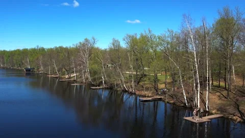 View of the lake from above. Early spring. Fishing lake with fishing platforms Stock Footage 274413978