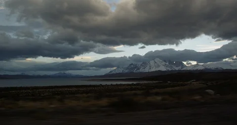 View of lake and mountain range from car Stock Footage 90080703