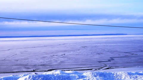 View of lake Baikal on a spring day. Frozen ice on the lake Stock Footage 112169751