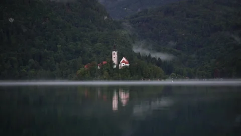 View of lake Bled and Bled island with Pilgrimage Church of the Assumption of Stock Footage 170839804