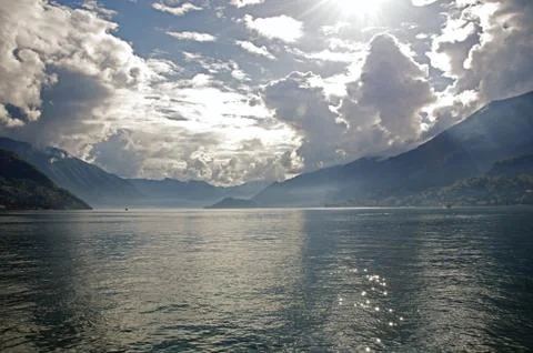 View of Lake Como in a cloudy day with sunshine in Bellagio Stock Photos