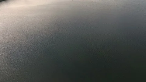View of the lake from the drone. Concept of resting on the lake, boating. Aer Video stock 196640237