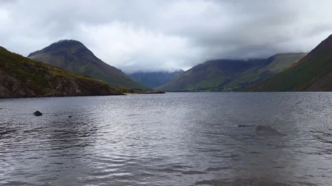 View of the lake at the foot of the mountains. Stock Footage 80992963