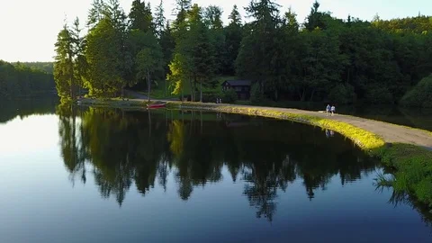 View of a lake in germany flying above with nice view on the trees. Ebnisee Stock Footage 76749981
