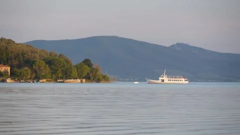 View of the Lake, Hills and Passing Riverboat in Soft Evening Light Stock Footage 245285241